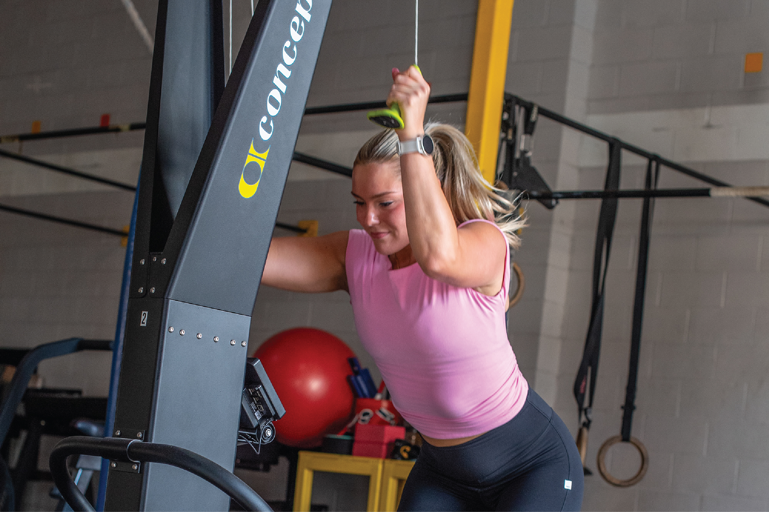 Coach Taylor-SDPT-Website Mockup-Final-2_Coach Taylor-The Program-Gallery 4 Taylor Battista-Coach Taylor-SD Personal Trainer working out doing pulldowns