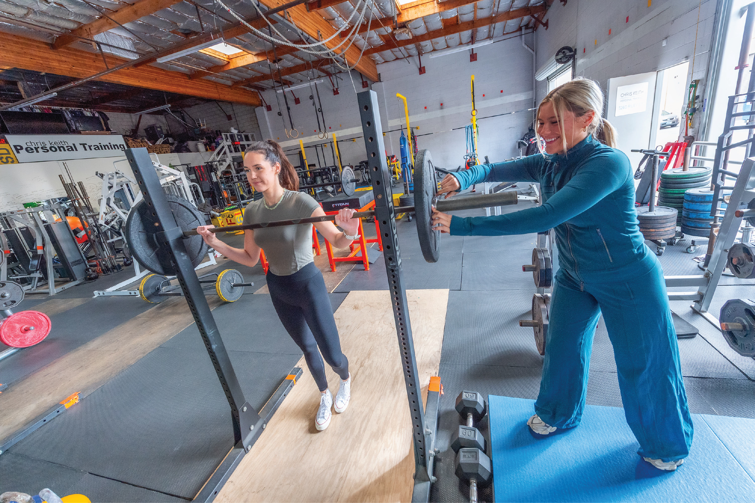 Coach Taylor-SDPT-Website Mockup-Final-2_Coach Taylor-The Program-Gallery 6 Taylor Battista-Coach Taylor-SD Personal Trainer Helping a client add weight